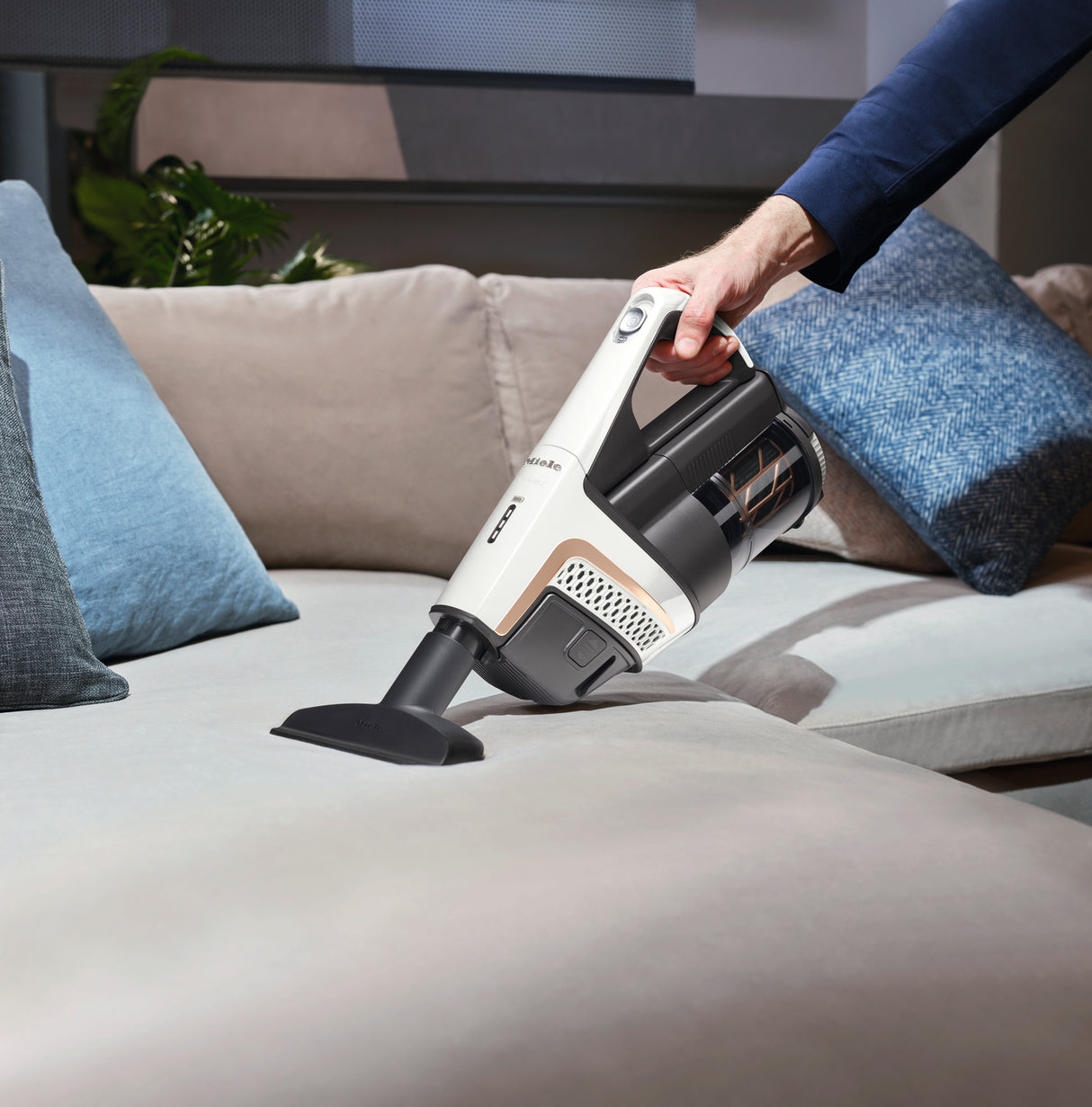 Miele Triflex HX2 Lotus White — wall-mounted charging dock