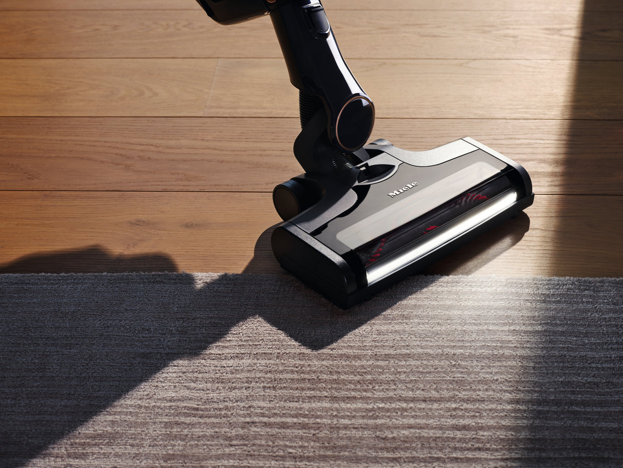 Miele Triflex HX2 Cat & Dog vacuuming under furniture