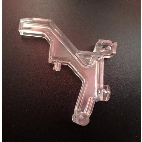 Clear plastic interlock for a Miele SEB236 power nozzle, showing the mounting arm
