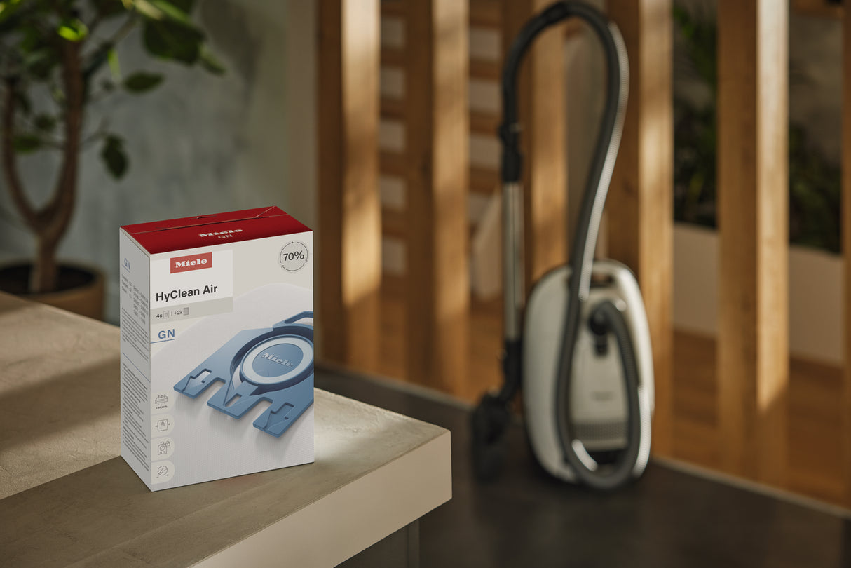 Miele HyClean Air GN FilterBags 4-pack lifestyle with canister vacuum