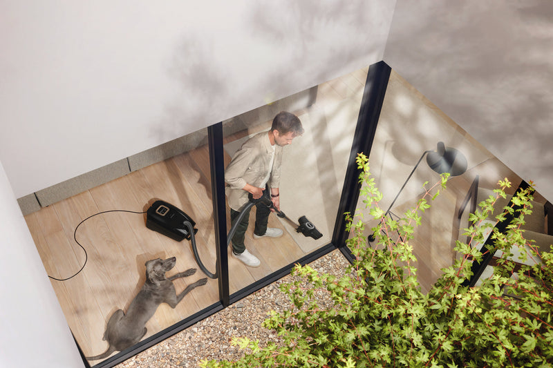 Miele Guard L1 Cat & Dog canister vacuum being used at home — Avon Vacuums repairs and services Miele, SEBO, Dyson and all major brands at our Avon, CT service center