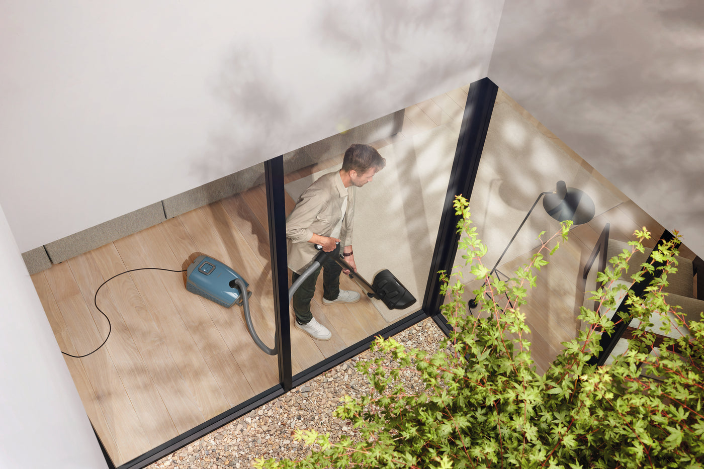 Miele canister vacuum cleaning hardwood floors in a Connecticut home at Avon Vacuums