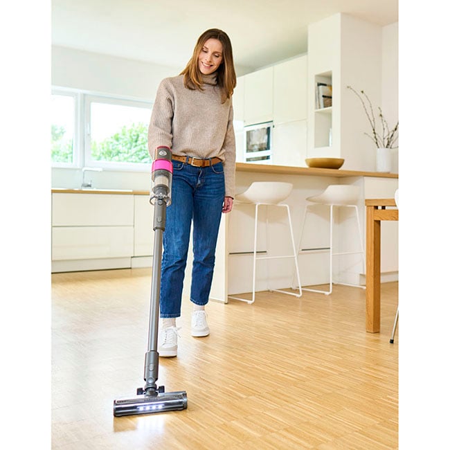SEBO BALANCE A1 cordless vacuum being used on a wood floor