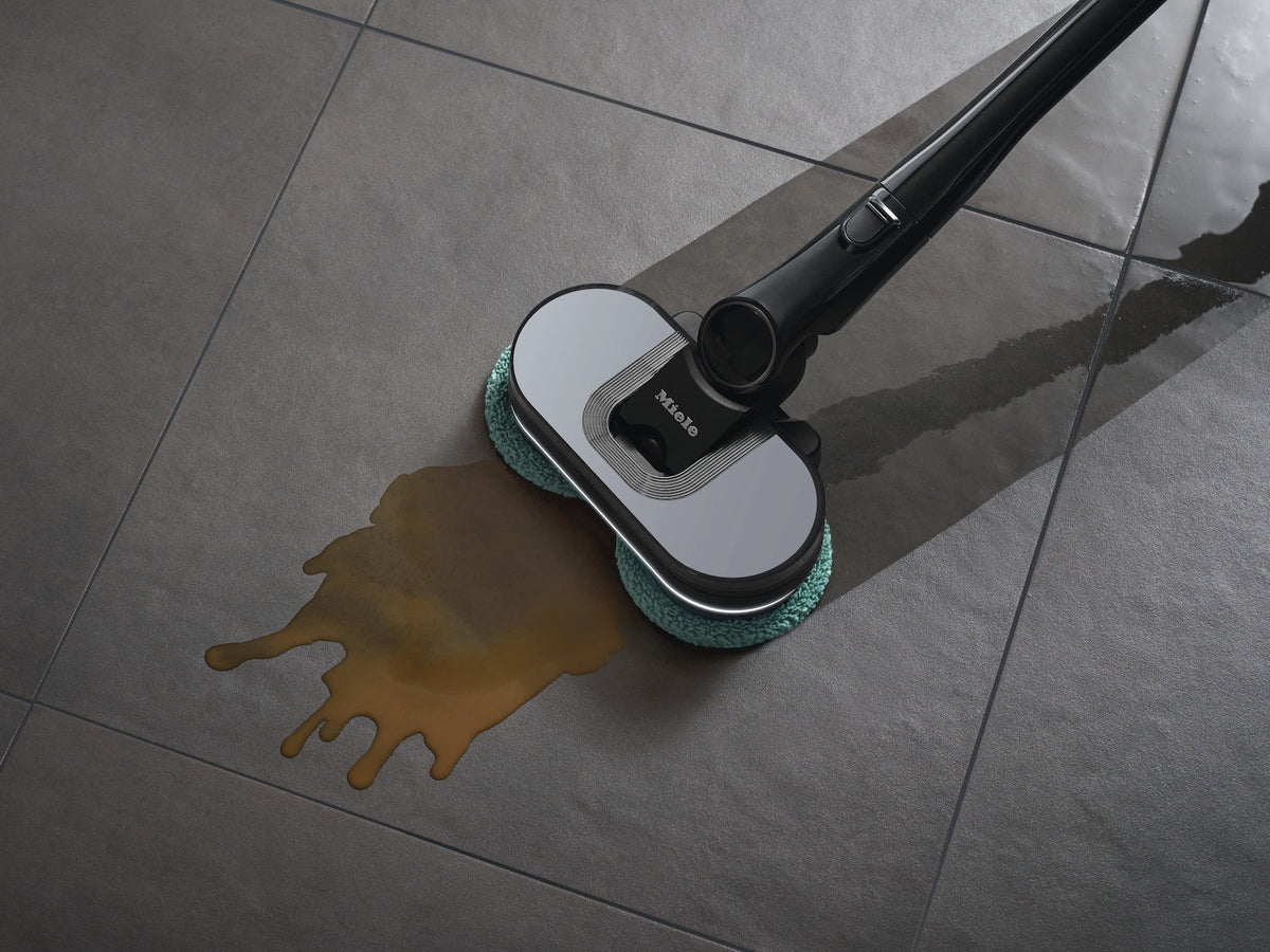 Miele Triflex HX3 Aqua cordless vacuum wet-cleaning a sealed hard floor