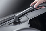 Genuine Miele SSP 10 Dusting Brush with Flexible Swivel Joint — shown cleaning a vehicle dashboard