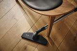 Genuine Miele Parquet Twister parquet brush | 7155710 — shown cleaning around a chair