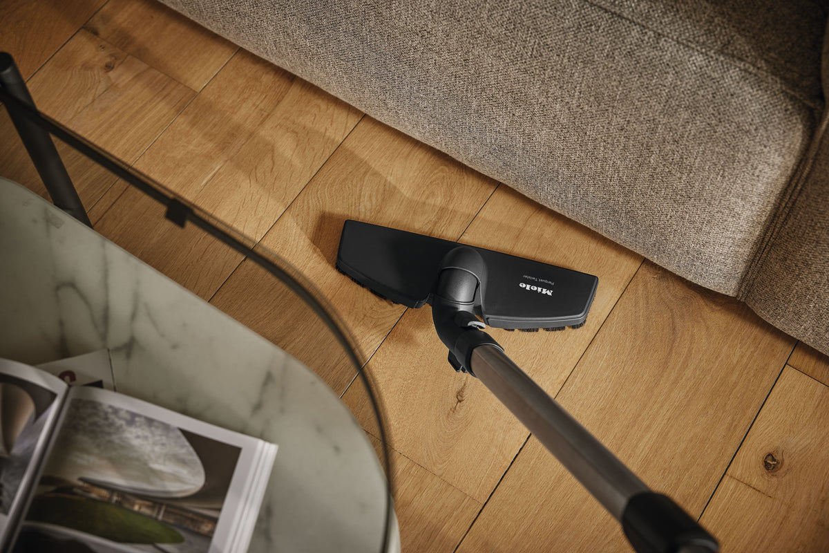 Genuine Miele Parquet Twister parquet brush | 7155710 — shown cleaning along a wood floor