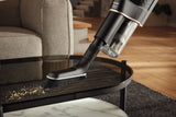Miele HX-UB Universal Brush for Cordless Sticks — shown cleaning a wicker surface