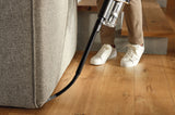 Miele HX-FCT 20 Duoflex Cleaning Kit — nozzle shown cleaning beside a sofa