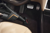 Miele HX-EC 10 Compact Handheld Brush — shown cleaning a vehicle footwell
