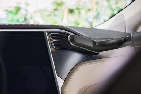 Miele HX-UB Universal Brush for Cordless Sticks — shown cleaning a vehicle door panel