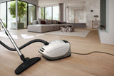 Miele Guard M1 Parquet XL cleaning a large hardwood floor in a home