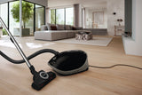 Miele Guard M1 Cat & Dog — lifestyle in-home cleaning scene