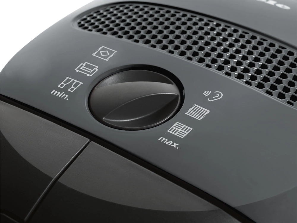 Close-up of Miele Classic C1 PowerLine suction control dial – variable suction settings