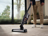 Miele Triflex HX2 Cat & Dog vacuuming sofa with handheld brush