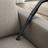 Genuine Miele SFD 10 Long Crevice Nozzle shown in a realistic home or maintenance setting