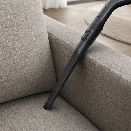 Genuine Miele SFD 10 Long Crevice Nozzle shown in a realistic home or maintenance setting