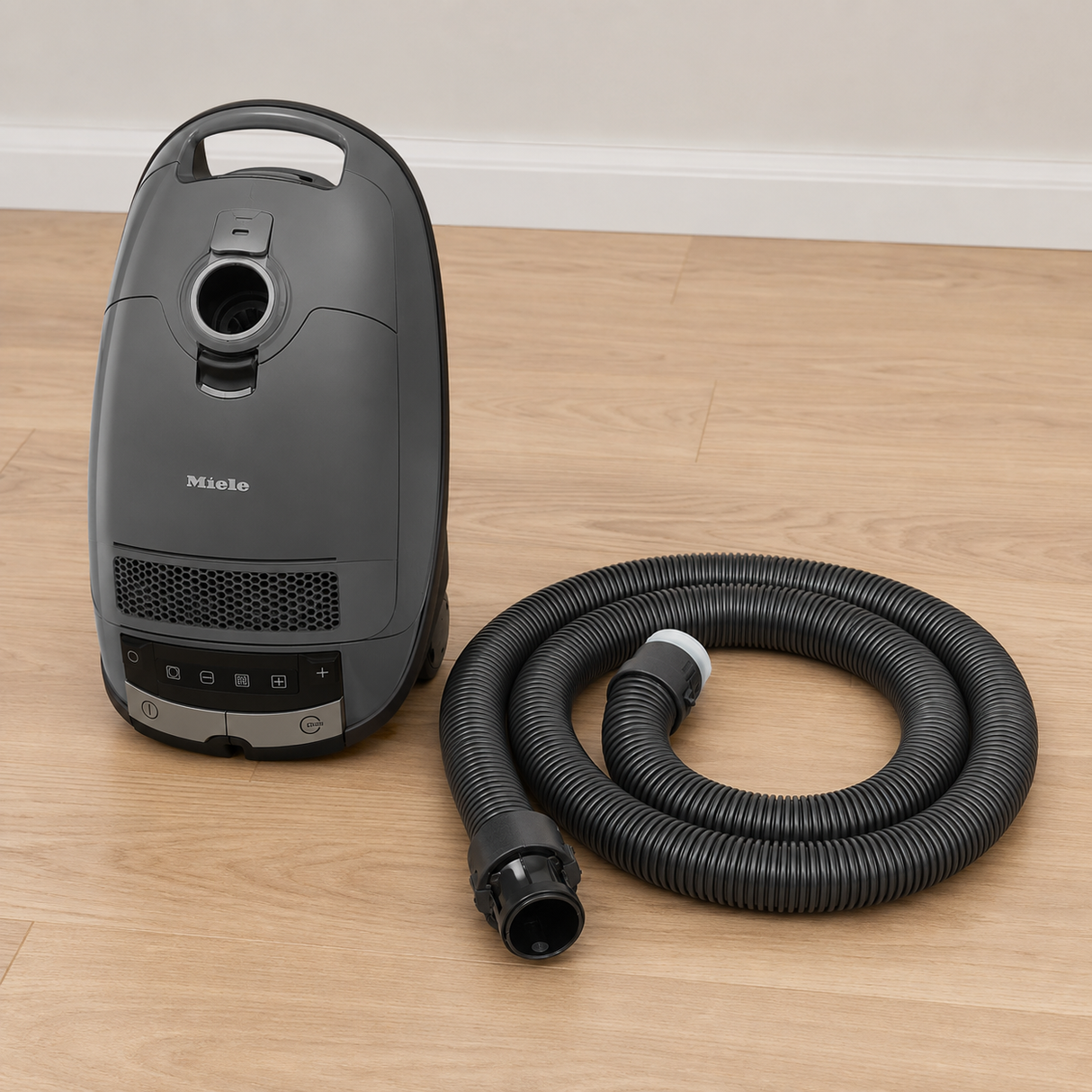 Genuine Miele Guard M1 / L1 SG Suction Hose | Replacement shown in a realistic home or maintenance setting
