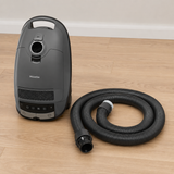 Genuine Miele Guard M1 / L1 SG Suction Hose | Replacement shown in a realistic home or maintenance setting