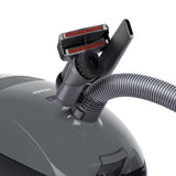 Miele Classic C1 Pure Suction PowerLine accessories – upholstery nozzle, crevice tool, and dust brush attached