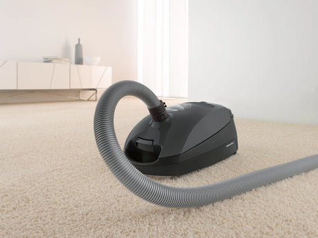 Miele Classic C1 Pure Suction PowerLine Canister Vacuum on carpet – Graphite Grey