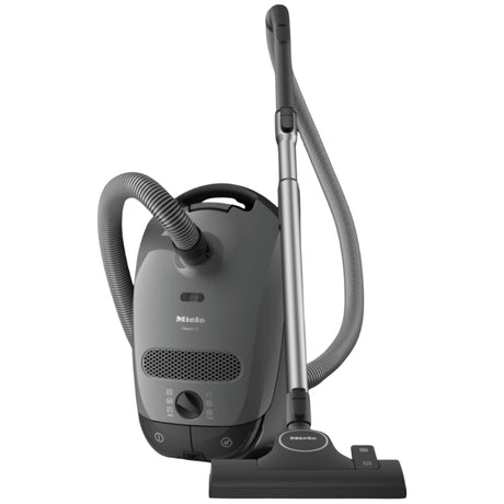 Gray Miele vacuum cleaner on a white background