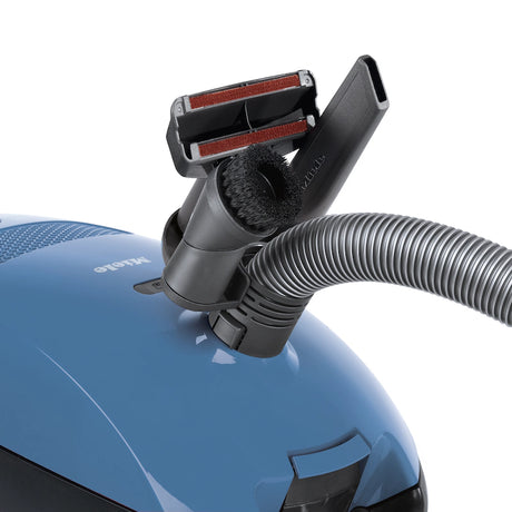 Miele Classic C1 Turbo Team PowerLine accessories – upholstery nozzle, crevice tool, and dust brush attached