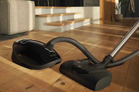 Miele Complete C3 Kona PowerLine Vacuum with Electrobrush on hardwood floor – Obsidian Black