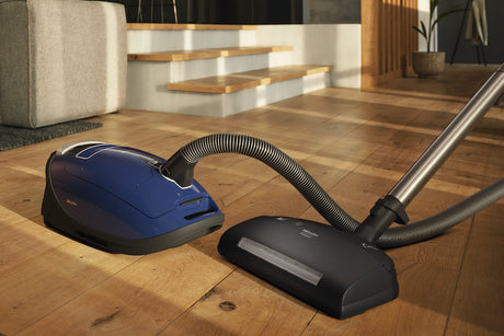 Miele Complete C3 Marin PowerLine Canister Vacuum on hardwood floor – Marine Blue