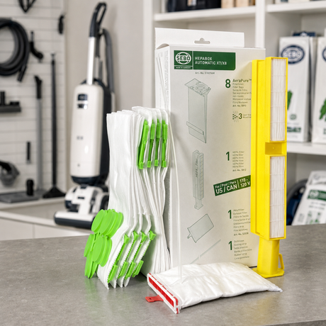 SEBO Automatic X7/X8 HEPA Service Box (51829AM) | 8 Bags, HEPA Filter & Sealing Strip displayed in a professional vacuum-care setting