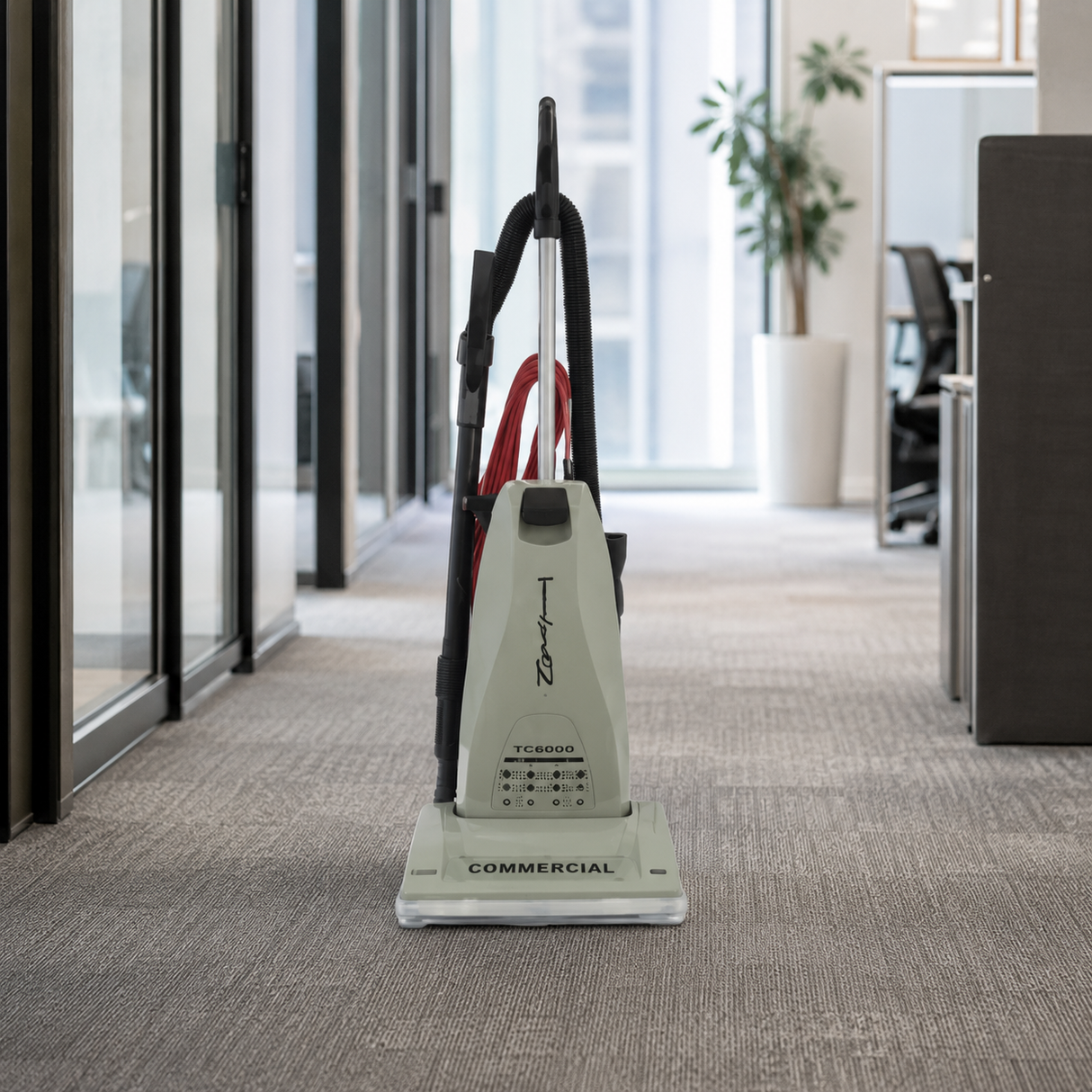 Titan TC6000.2 commercial upright vacuum in an office corridor