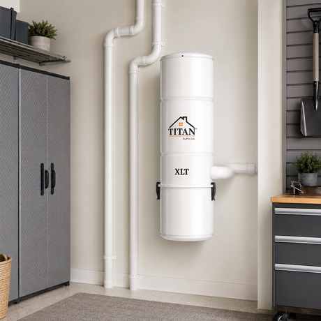 Titan TCS-9902 central vacuum power unit installed in a clean garage